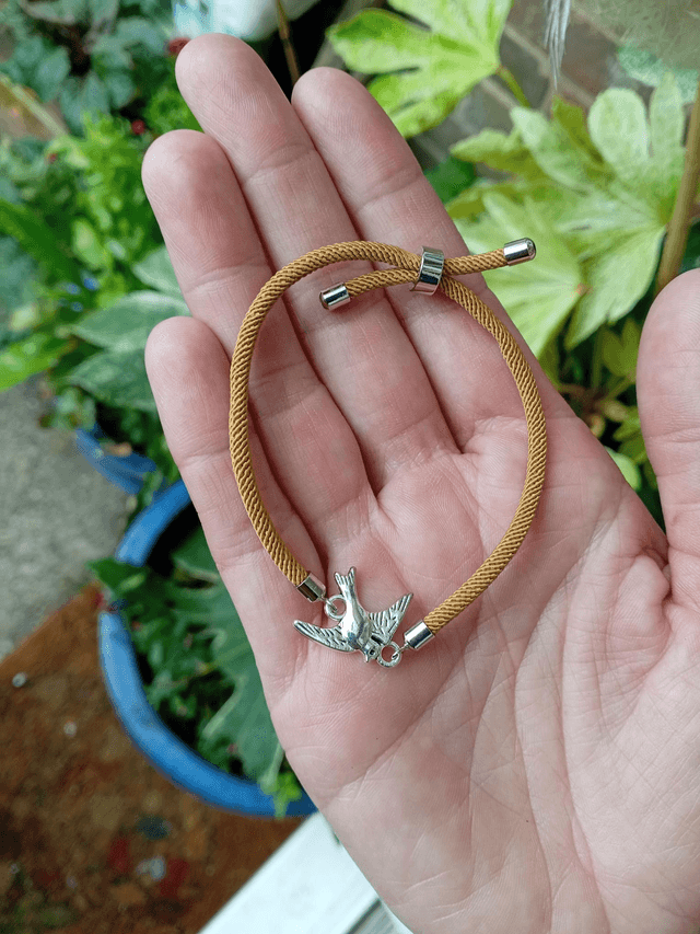 Gold kids bracelet with a Bird Charm