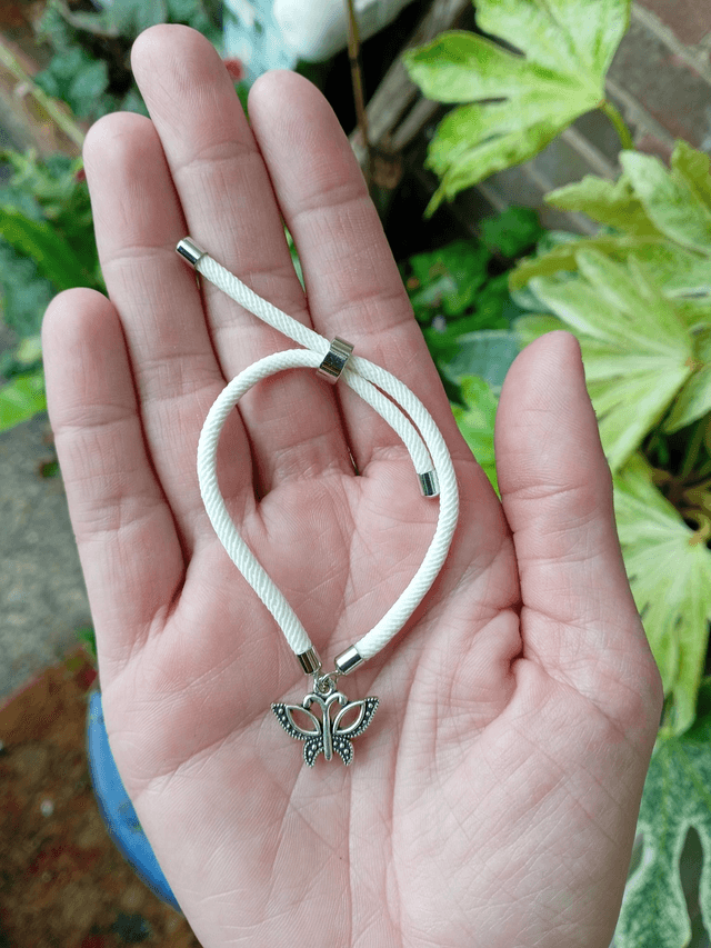 White kids bracelet with a Butterfly Charm