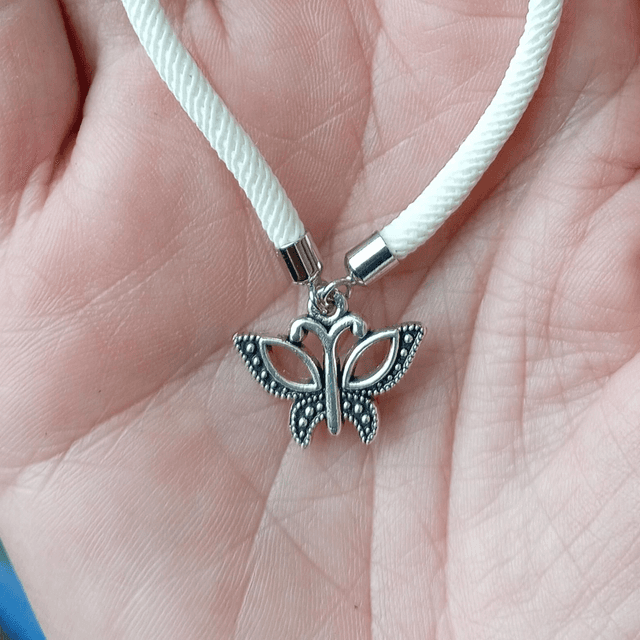 White kids bracelet with a Butterfly Charm
